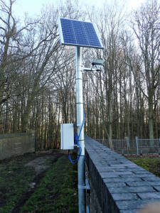 Solar powered camera on railway bridge